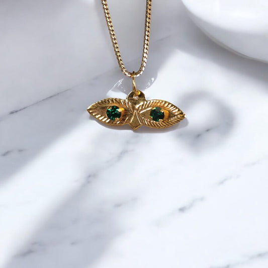10K YG Saint Lucy Eyes Pendant / 0.29gr / 0.7in / Green Zircons