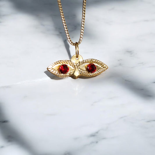 10K YG Saint Lucy Eyes Pendant / 0.29gr / 0.7in / Red Zircons