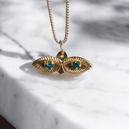 10K YG Saint Lucy Eyes Pendant / 0.29gr / 0.7in / Cyan Zircons
