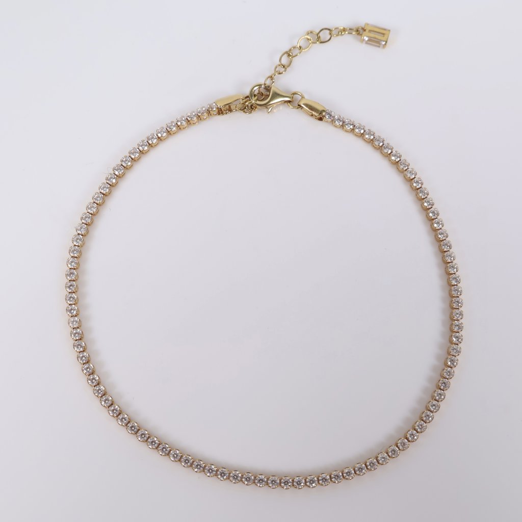 18K YG Tennis Bracelet / 4gr / 2mm / 9.5in Adjustable / White Zircons