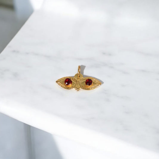10K YG Saint Lucy Eyes Pendant / 0.29gr / 0.7in / Red Zircons