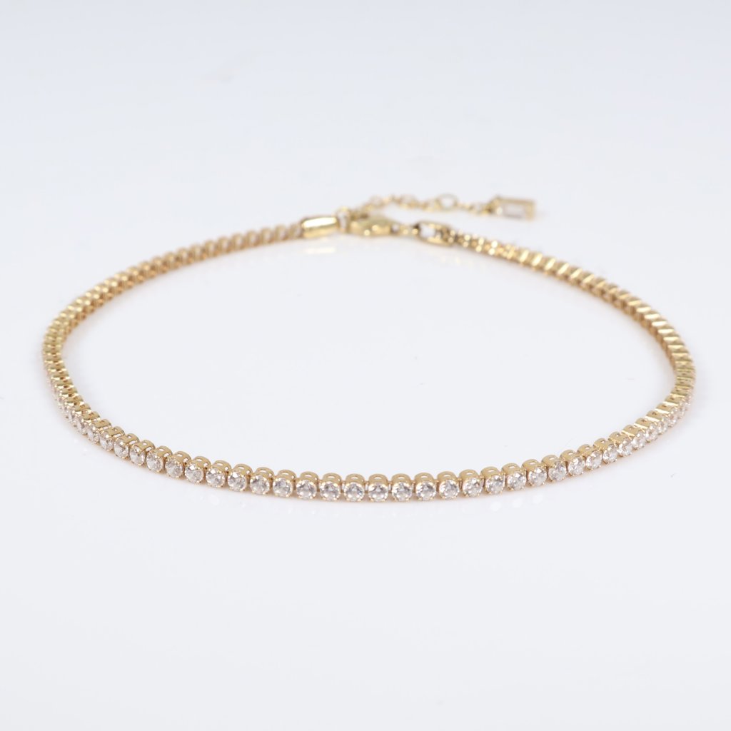 18K YG Tennis Bracelet / 4gr / 2mm / 9.5in Adjustable / White Zircons