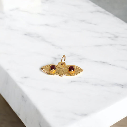 10K YG Saint Lucy Eyes Pendant / 0.29gr / 0.7in / Wine Zircons